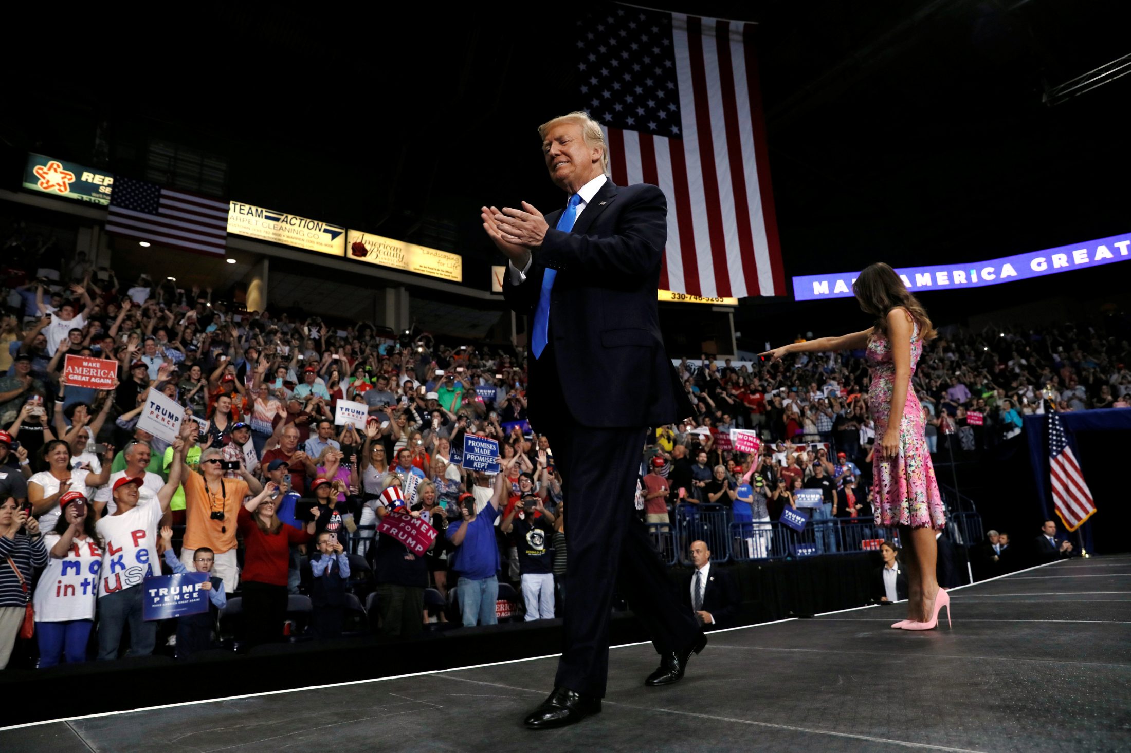 President Donald Trump and first lady Melania Trump take the stage for a rally with supporters in an arena in Youngstown, Ohio. Photo by Jonathan Ernst/Reuters